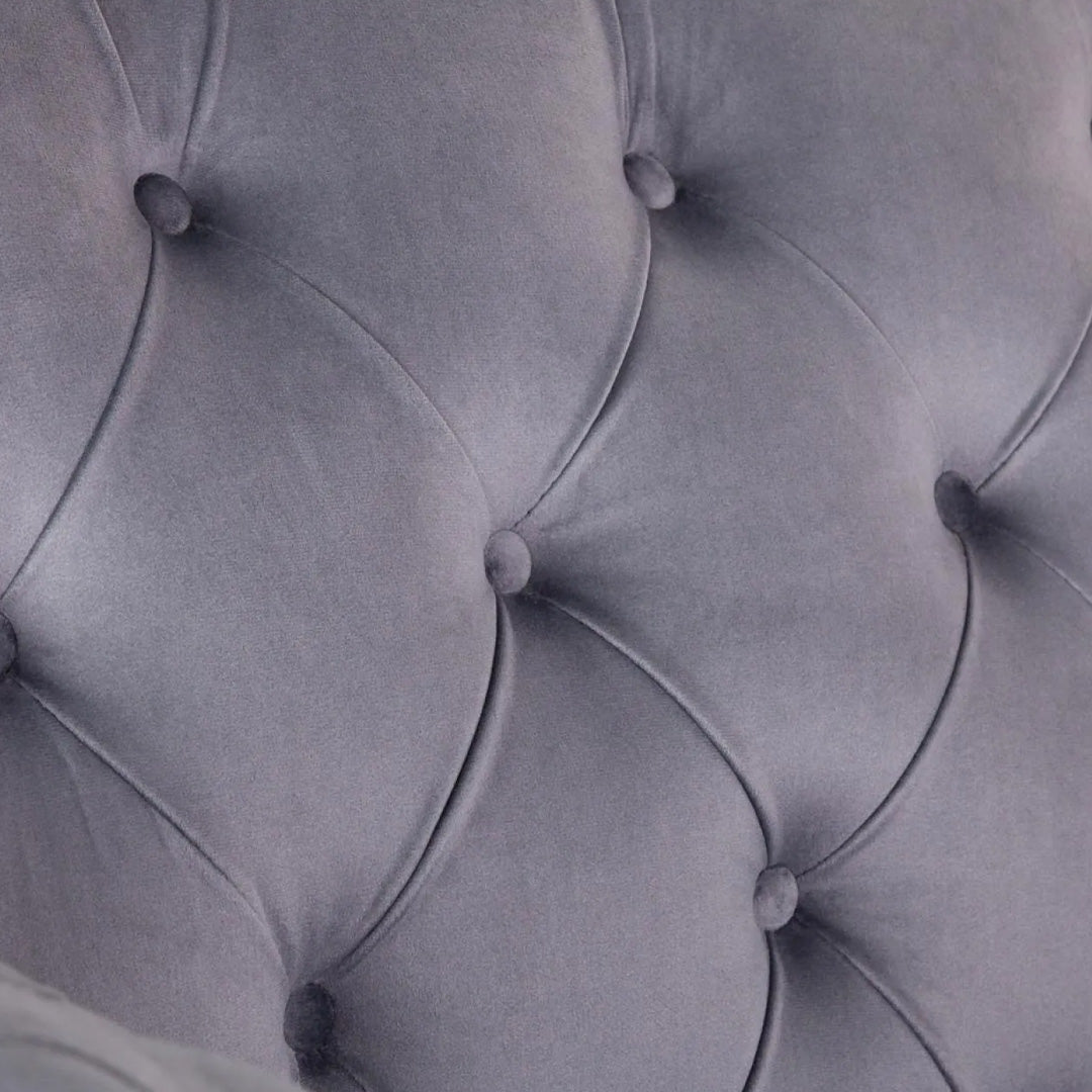 "Soft velvet upholstery with carefully placed button accents on the  Grey Torino Corner Sofa"