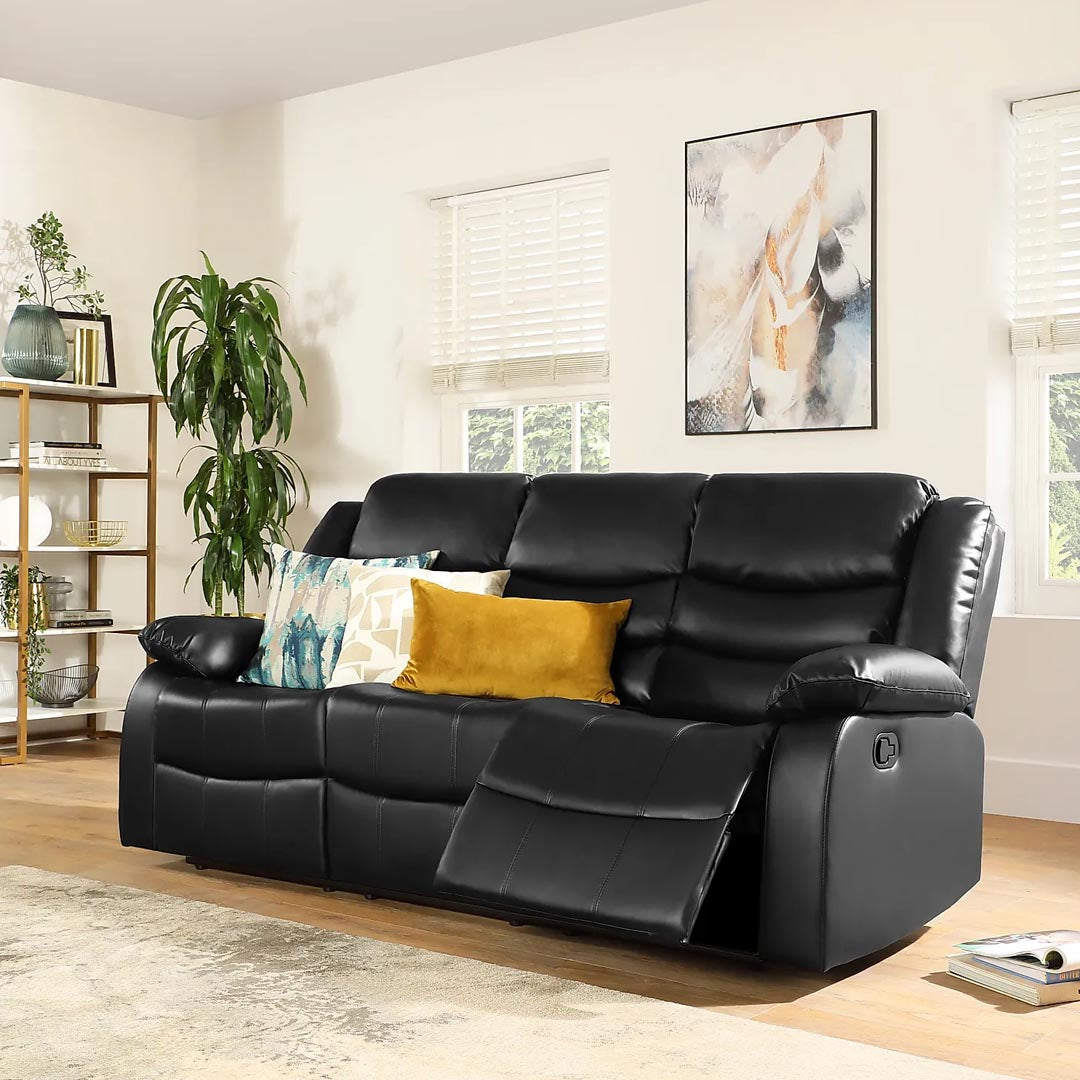"Milan 3 seater black leather manual recliner with cup holders and center console."