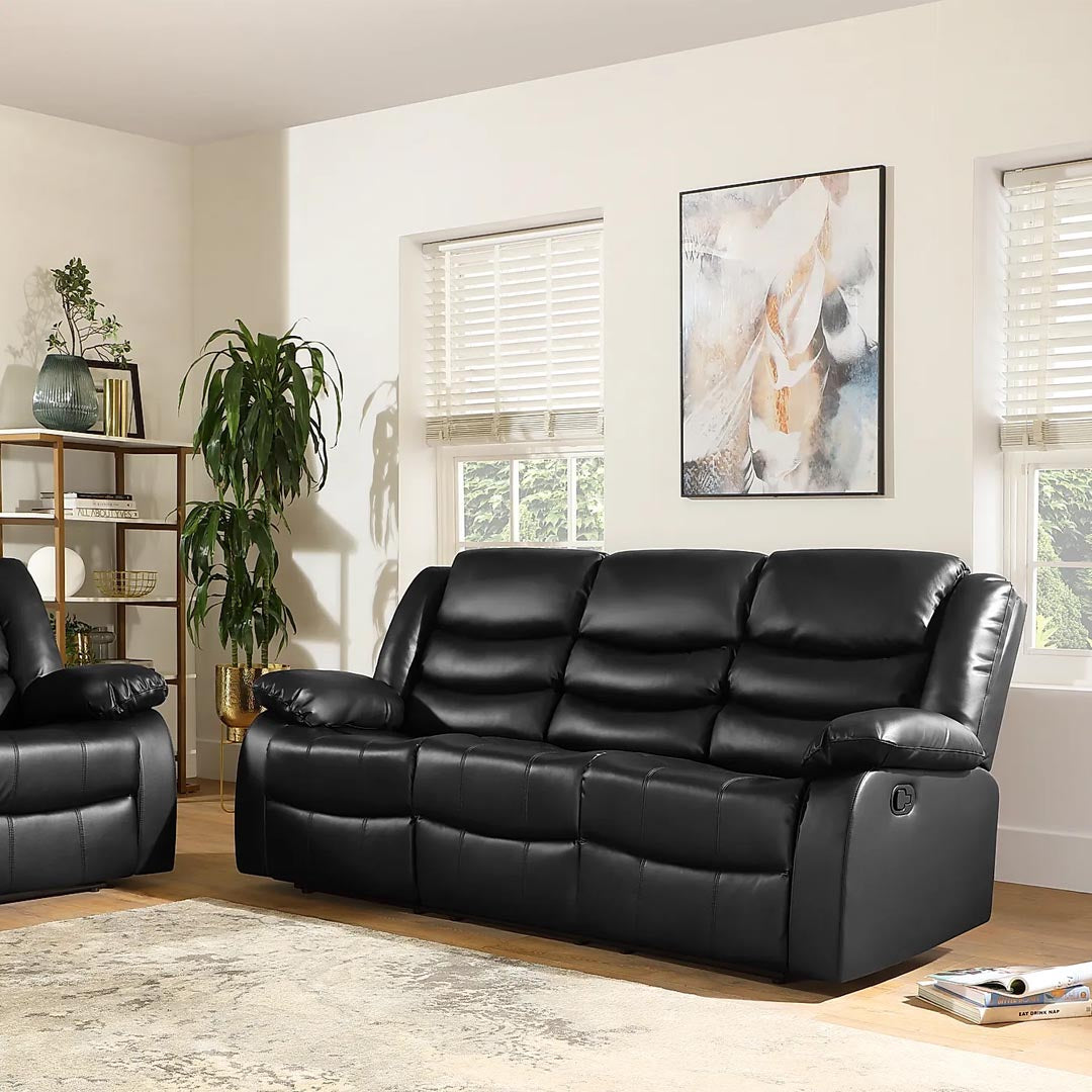 "Italian-style black recliner sofa suite with leather finish, drop-down drink holder."
