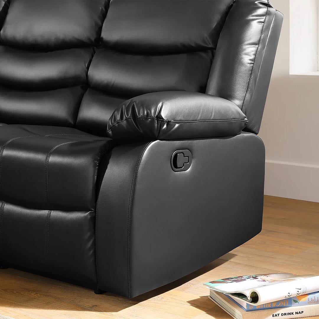 "Modern black leather recliner suite with padded armrest"