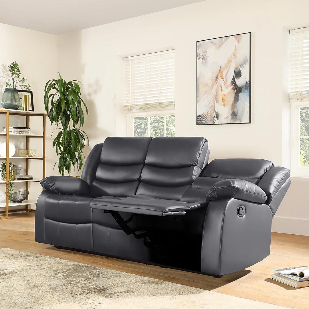 "Spacious grey leather recliner with manual reclining seats and high back support."