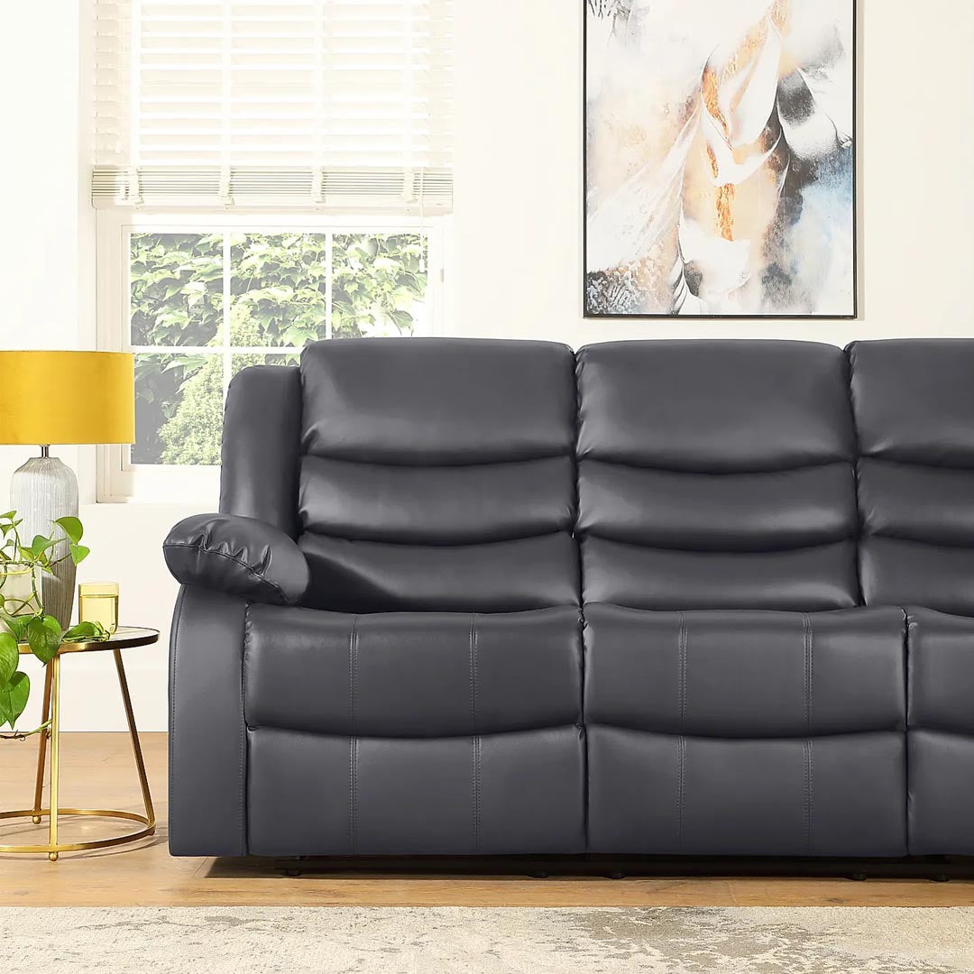 "Center console with dual cup holders and storage on Milan grey 3 seater recliner."