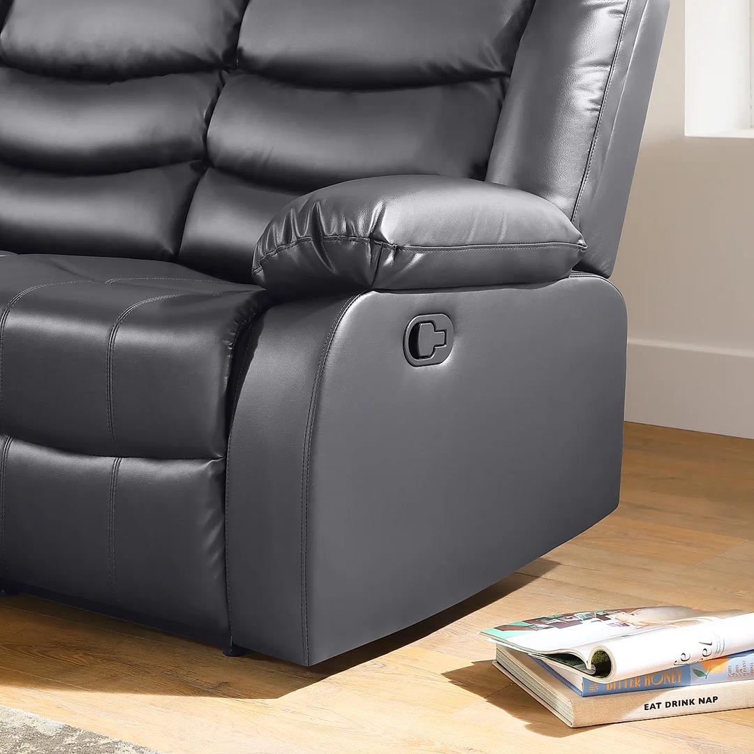 "Luxurious grey leather recliner sofa featuring cushioned armrests for comfort"