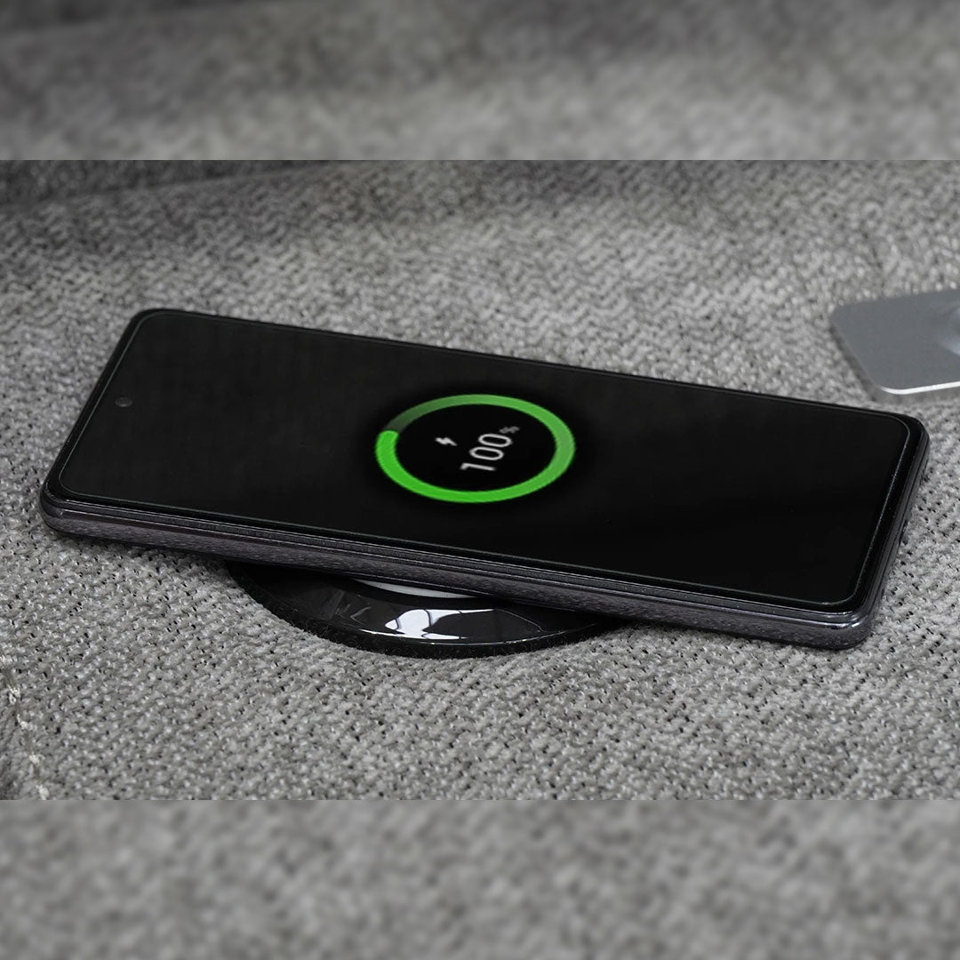 "Wireless charging armrest on Montana grey fabric recliner sofa, offering built-in device charging for effortless modern convenience."

