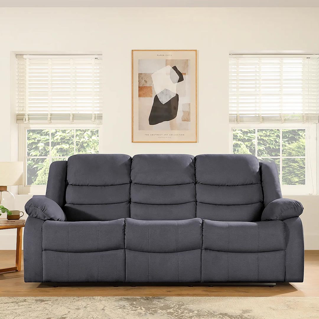 "Cozy and comfy Pisa 3+2-seater recliner sofa in grey fabric with footrest, high back support, and manual recline for a comfortable lounging experience."