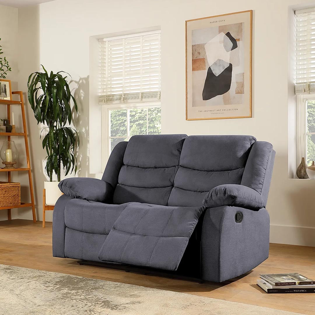 "Pisa grey fabric 2-seater recliner sofa with manual reclining, high back, and footrest for added comfort."