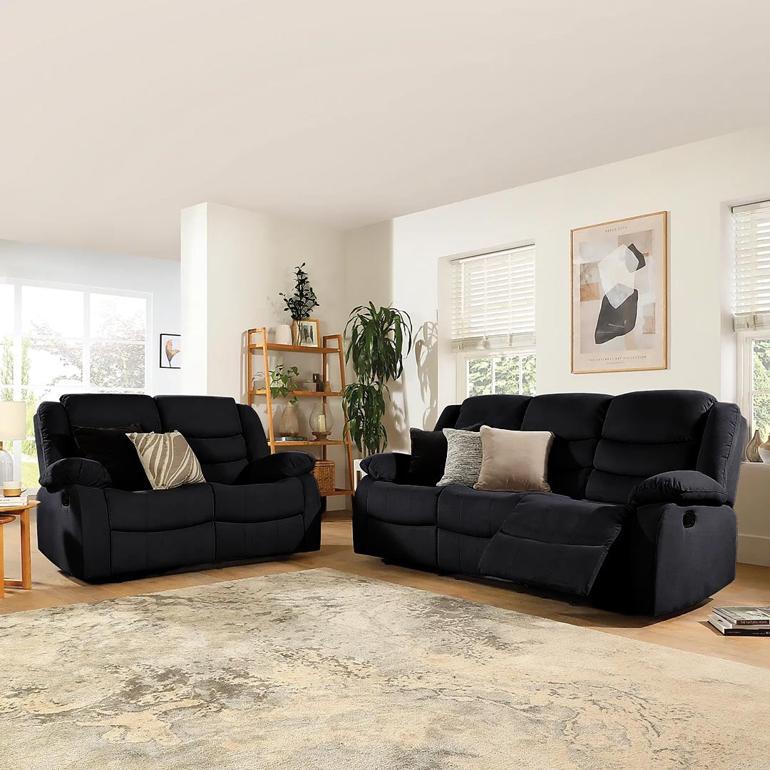​"Modern black fabric reclining sofa enhancing minimalist interior design"