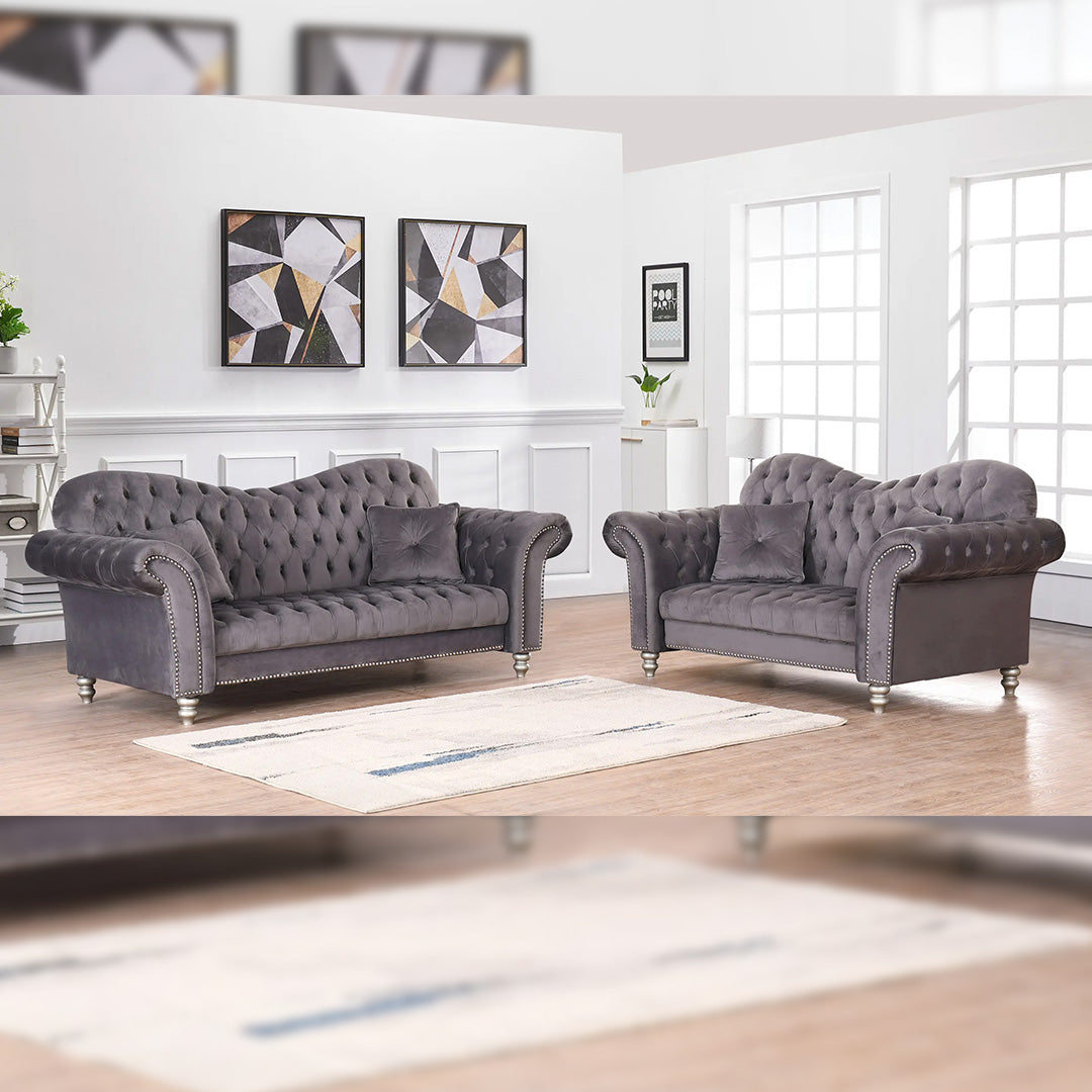 "Versatile grey velvet Chesterfield 3+2 seater sofa with rolled arms, fitting seamlessly into both modern and vintage-inspired home decor."