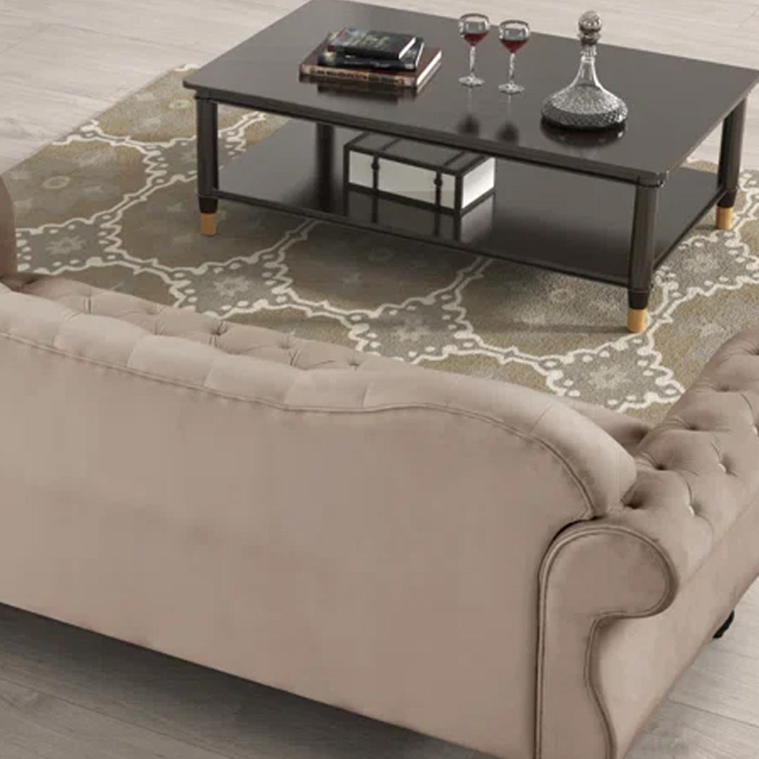 "Detailed view of deep button tufting on beige Chesterfield sofa, showcasing timeless craftsmanship and luxurious design."
