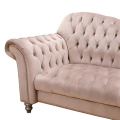 "Rolled armrest on beige Chesterfield sofa, a signature feature adding comfort and traditional charm."