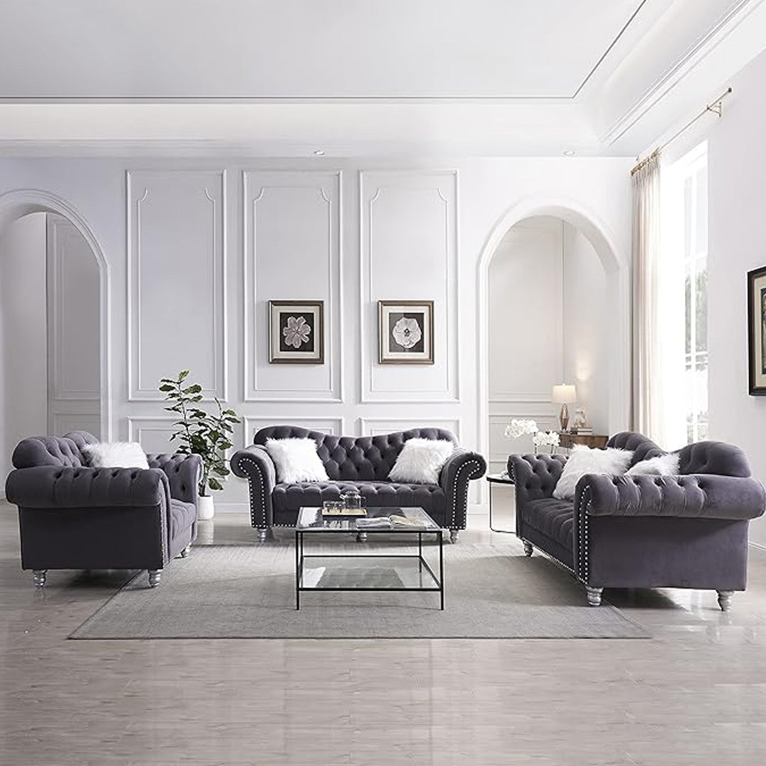 "Detailed view of classic tufted buttons on grey velvet Chesterfield sofa, enhancing vintage and timeless appeal in living room furniture."