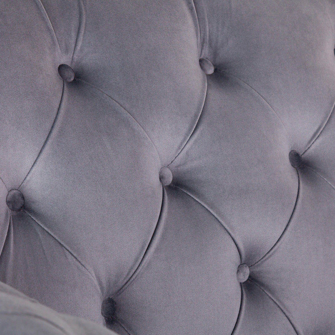 "Refined 2 seater elegance sofa with button detailing and slim profile"